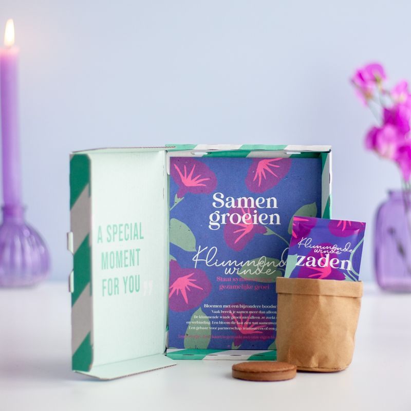 Paars doosje met Klimmende Winde zaden met de tekst samen groeien erop