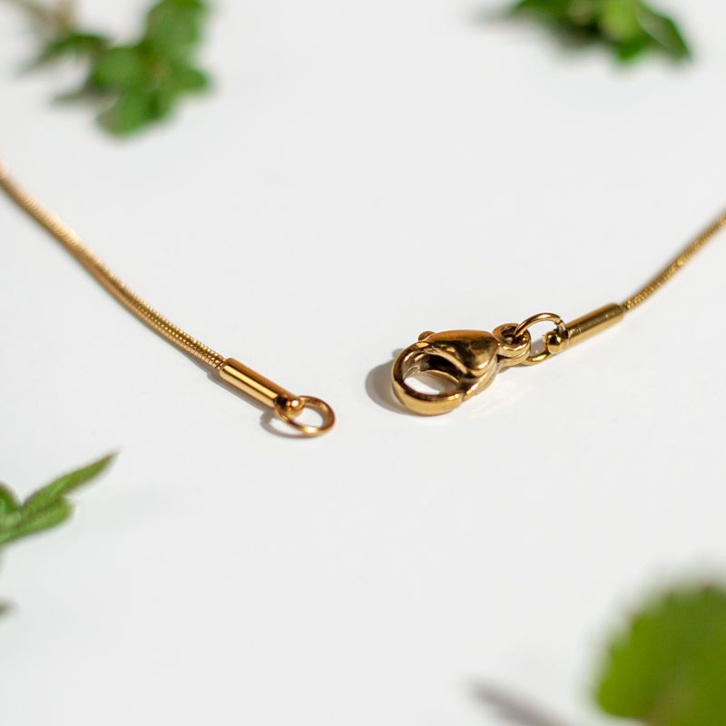 Goudkleurige halsketting met klavertje vier hanger